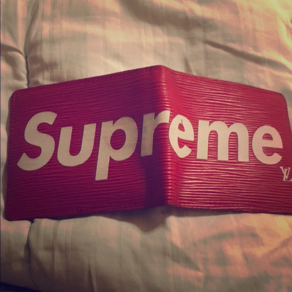Red Supreme Louis Vuitton Wallet. Never been used.
